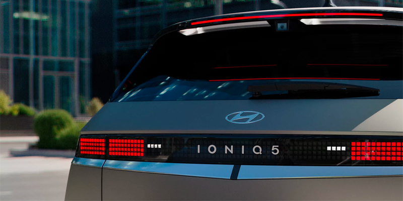 The rear view of a 2025 Hyundai IONIQ 5 showing its LED lights and logo.